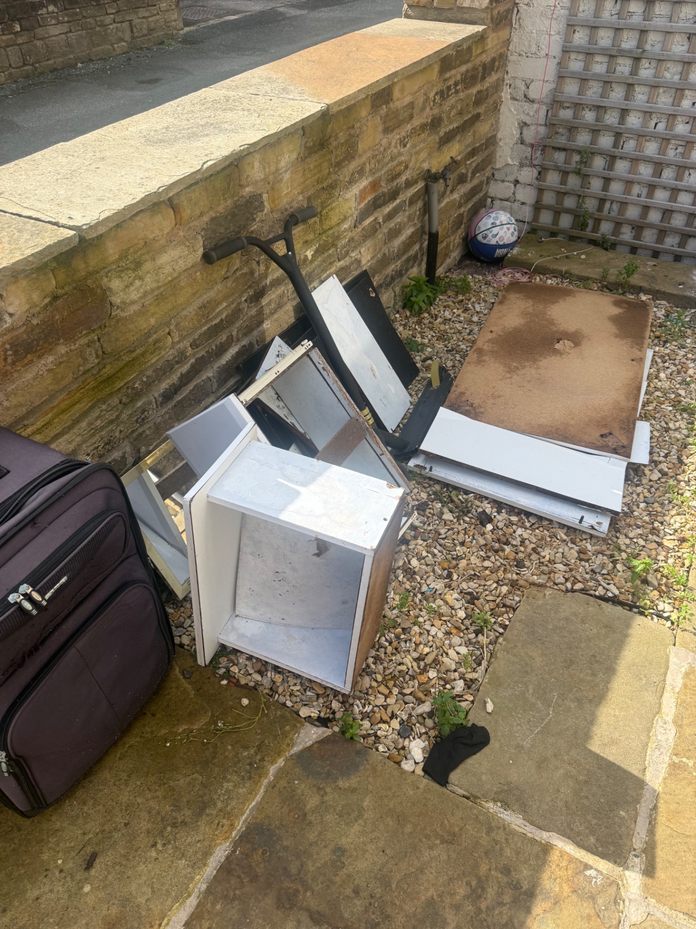 Bulky household items cleared from a garden