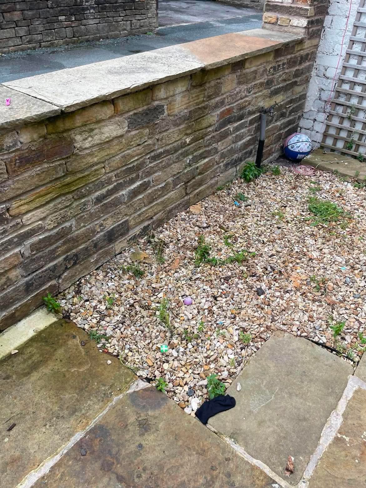 The same garden after the items were cleared away